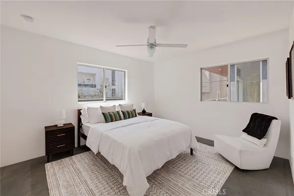 a room with furniture and a glass door shower