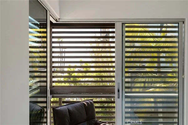 a living room with furniture tv and a window