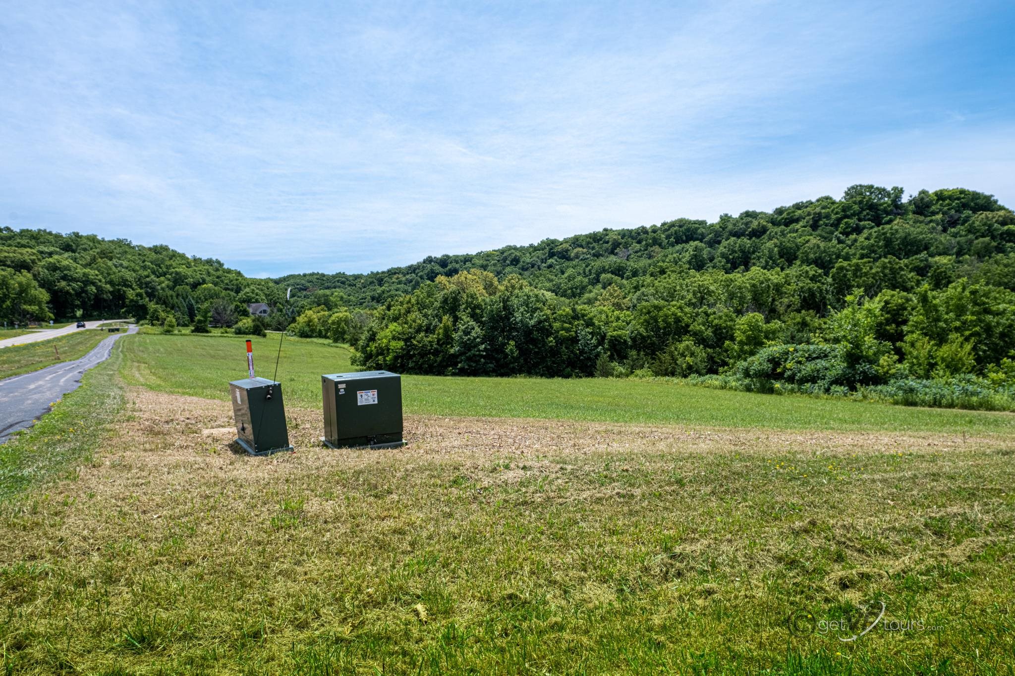 a view of a field with an ocean