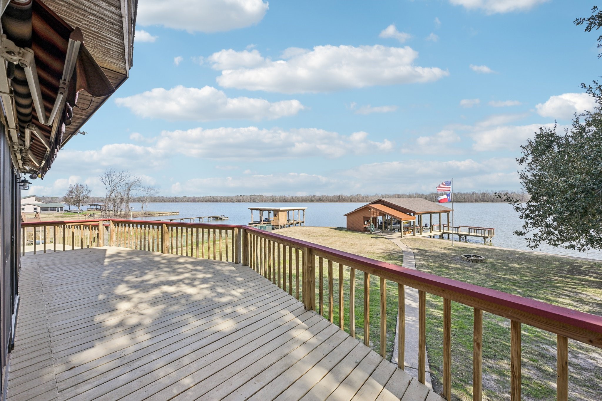 94 Lakeview Drive Huntsville, TX 77320 - Photo 8 of 45 Deck off the main living area with Canopy for shade.