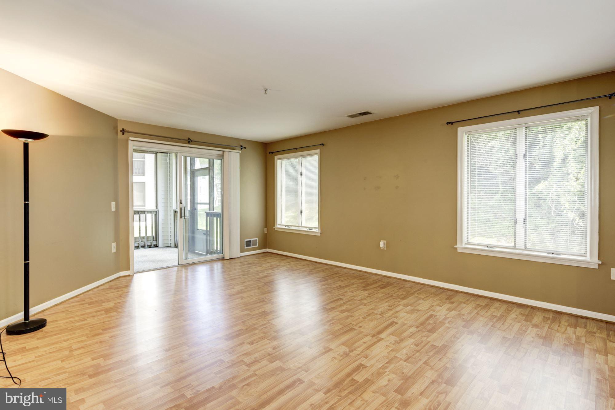 425 Pleasanton Road, Unit C12 Westminster, MD 21157 - Photo 10 of 30 Living Room w/Slider to Screened Porch