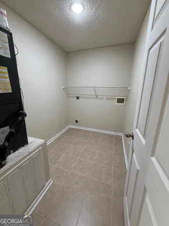a view of storage and utility room with empty racks