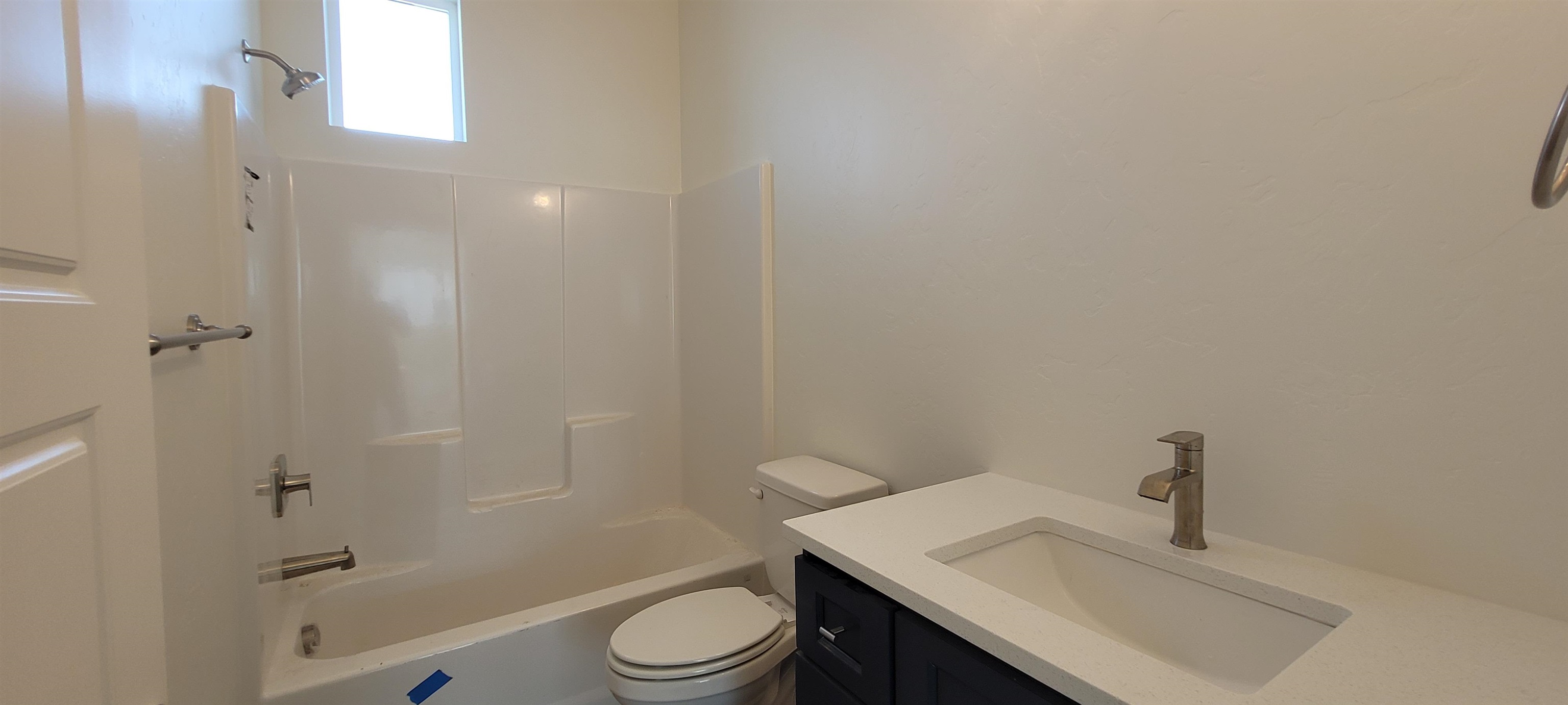 1674 Tungsten Way Fruita, CO 81521 - Photo 8 of 17 a bathroom with a sink a toilet and shower