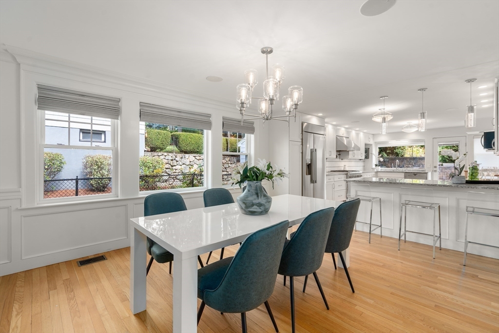 152 Bellevue Road Watertown, MA 02472 - Photo 11 of 42 a view of a dining room with furniture window and wooden floor