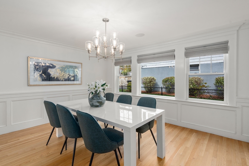 152 Bellevue Road Watertown, MA 02472 - Photo 13 of 42 a view of a dining room with furniture wooden floor and chandelier