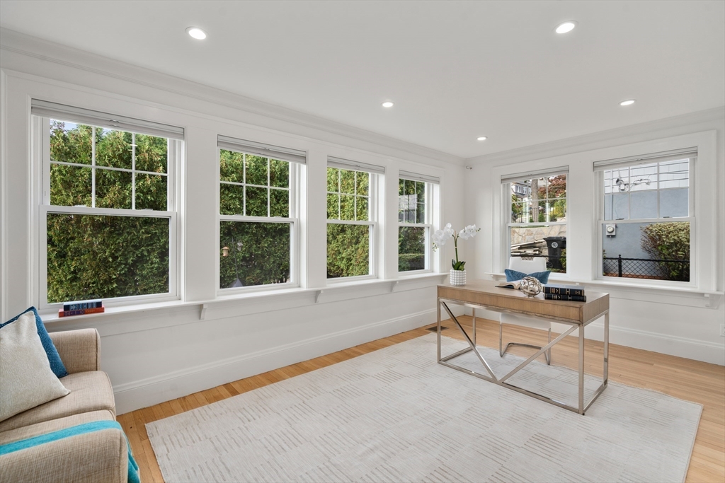 152 Bellevue Road Watertown, MA 02472 - Photo 14 of 42 a living room with furniture and large windows