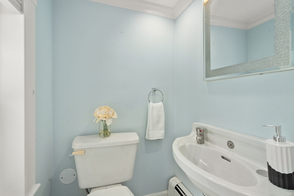 152 Bellevue Road Watertown, MA 02472 - Photo 15 of 42 a bathroom with a toilet a sink and mirror