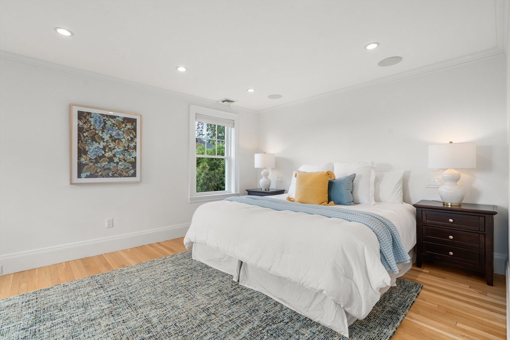 152 Bellevue Road Watertown, MA 02472 - Photo 16 of 42 a bedroom with a bed and a lamp