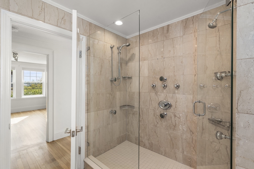 152 Bellevue Road Watertown, MA 02472 - Photo 20 of 42 a bathroom that has a glass shower door