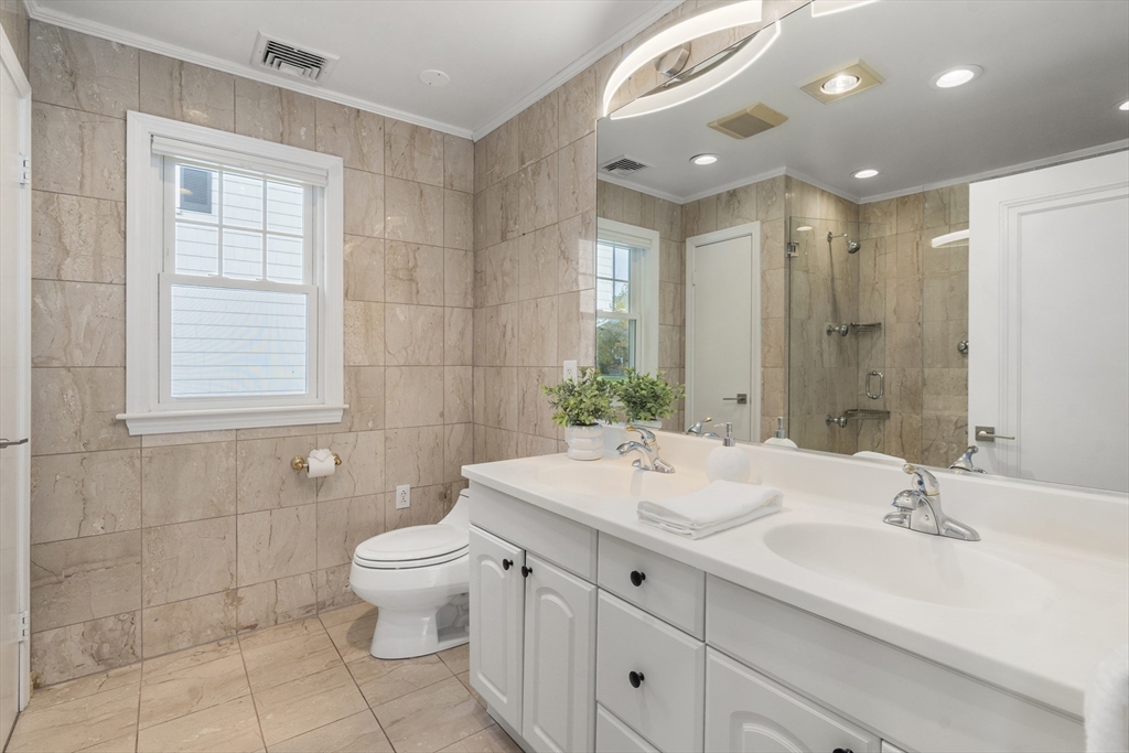 152 Bellevue Road Watertown, MA 02472 - Photo 21 of 42 a bathroom with a sink a toilet and shower