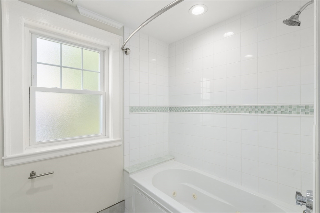 152 Bellevue Road Watertown, MA 02472 - Photo 24 of 42 a bathroom with a bathtub and a window