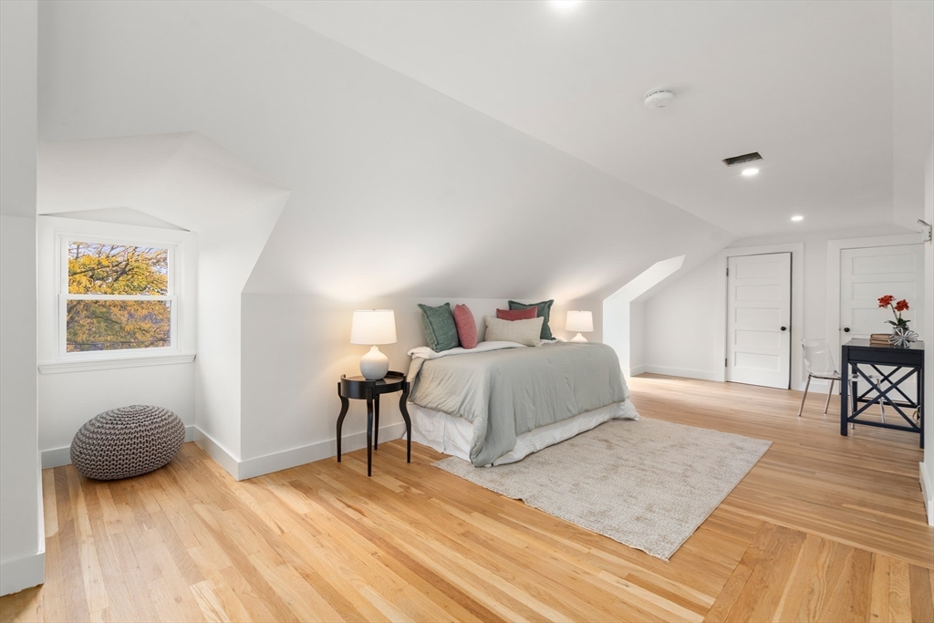 152 Bellevue Road Watertown, MA 02472 - Photo 25 of 42 a bedroom with a bed and a couch