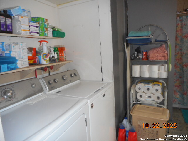 1212 Magnolia Street Jourdanton, TX 78026 - Photo 13 of 14 a utility room with dryer and washer