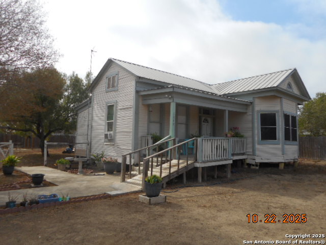 1212 Magnolia Street Jourdanton, TX 78026 - Photo 2 of 14 a view of a house with a patio
