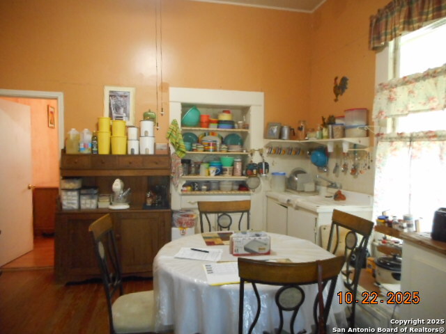 1212 Magnolia Street Jourdanton, TX 78026 - Photo 7 of 14 a very nice looking dining room with a table and chairs