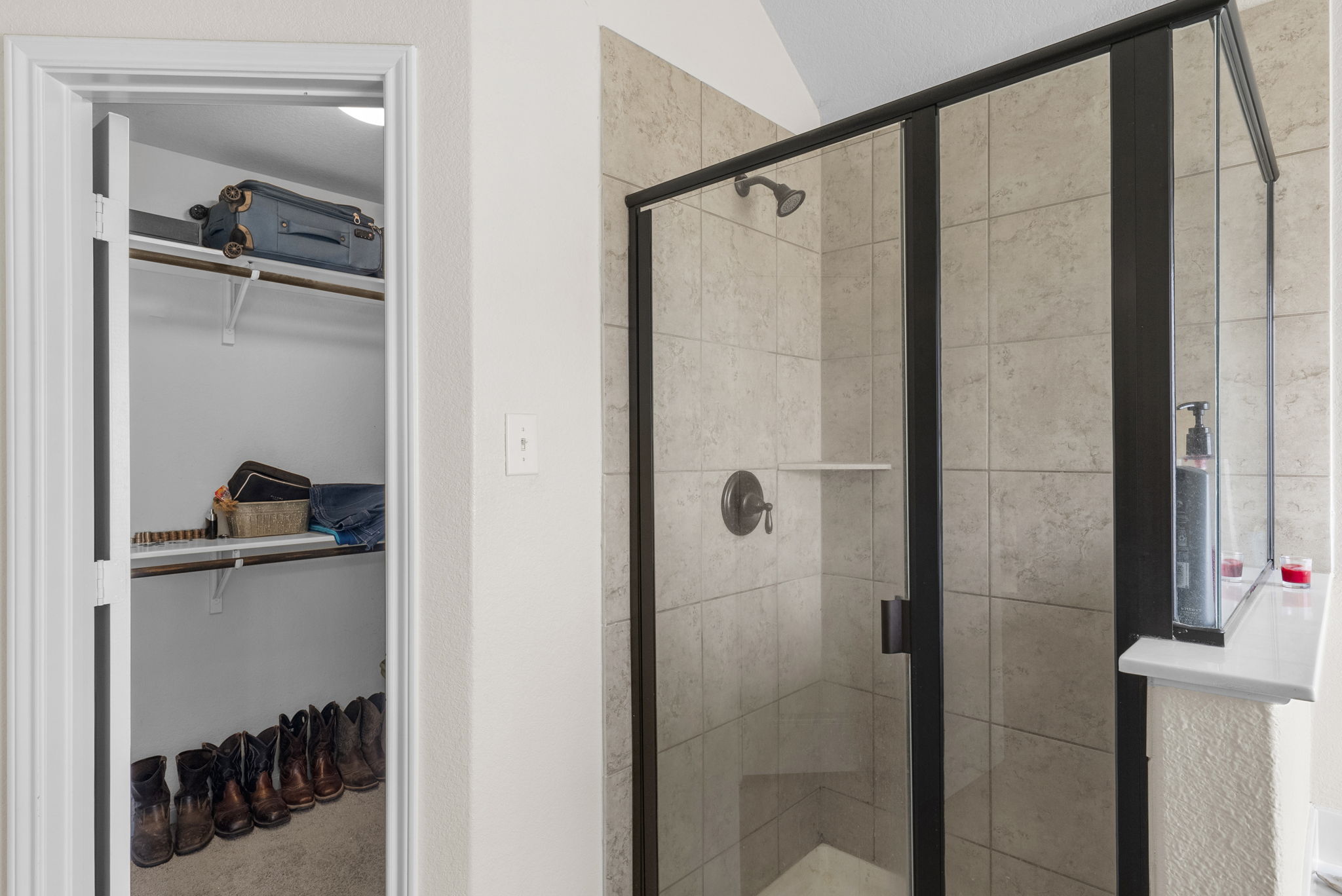 1617 Treeta Trail Kyle, TX 78640 - Photo 32 of 39 Bathroom with a spacious closet and a stall shower
