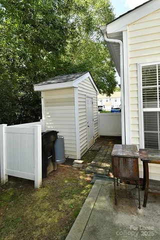 a view of house with backyard