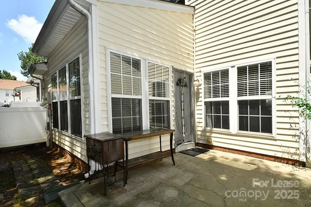 a view of a brick house with a large window