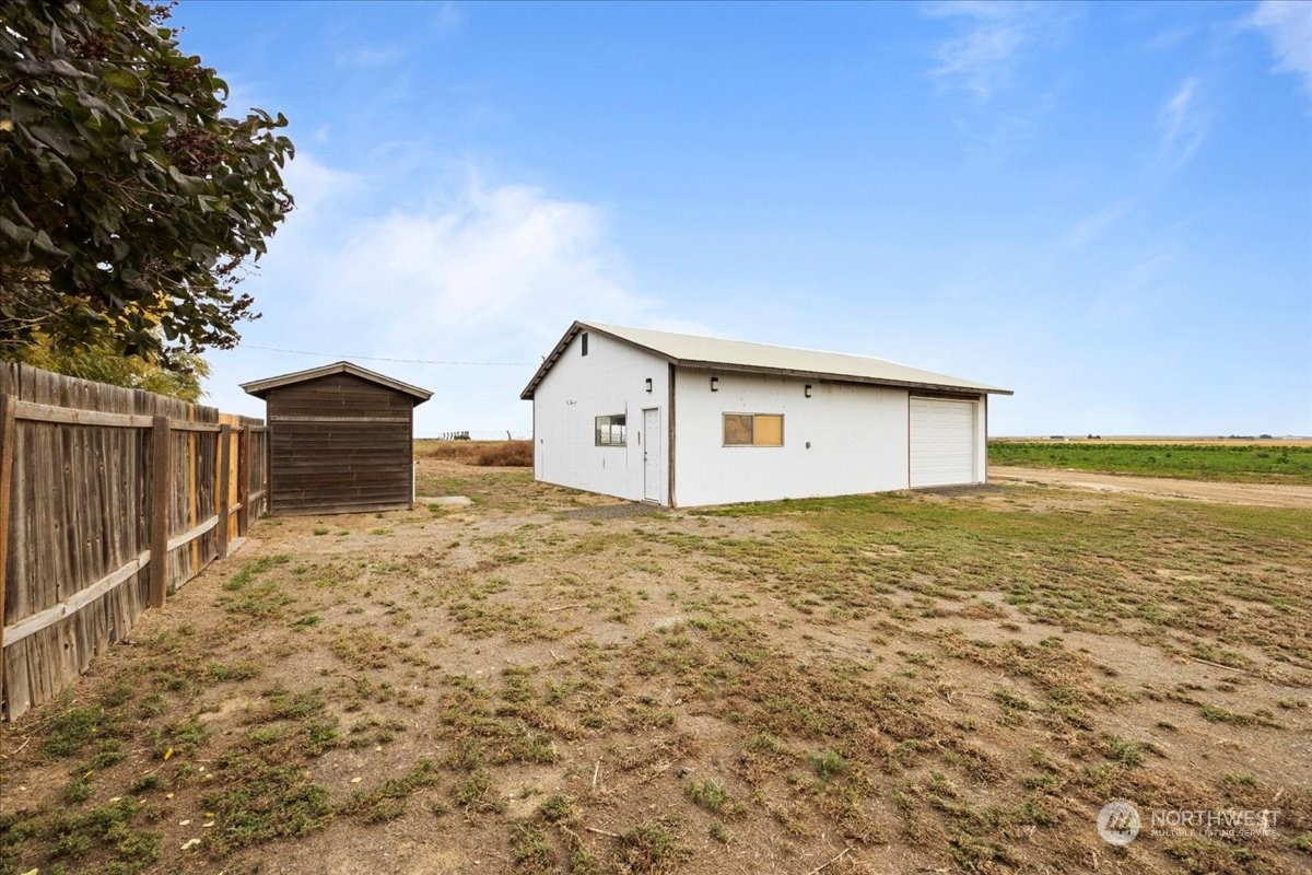 465 South Lemaster Road Othello, WA 99344 - Photo 34 of 40 a view of a house with backyard and wooden fence