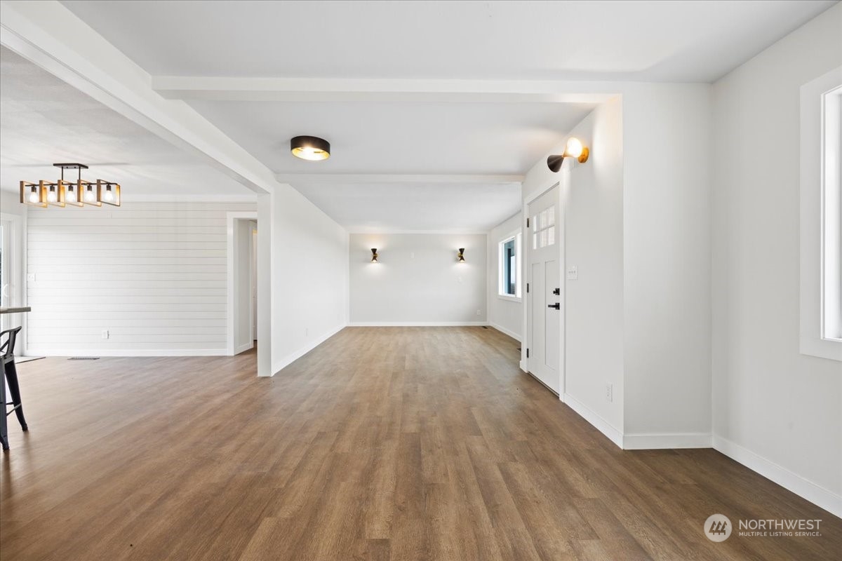 465 South Lemaster Road Othello, WA 99344 - Photo 9 of 40 a view of a room with wooden floor and white walls