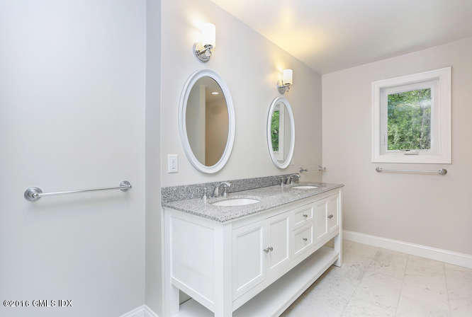 5 Carol Place Riverside, CT 06878 - Photo 13 of 25 a bathroom with a granite countertop double vanity sink and a mirror