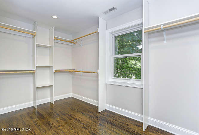 5 Carol Place Riverside, CT 06878 - Photo 15 of 25 a view of an empty room with wooden floor fridge and a window