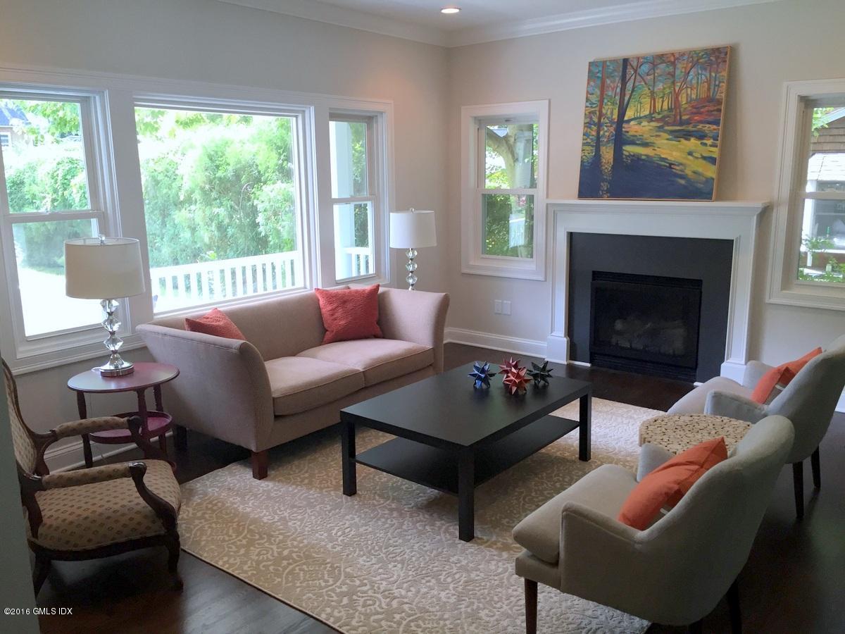5 Carol Place Riverside, CT 06878 - Photo 4 of 25 a living room with furniture and a fireplace