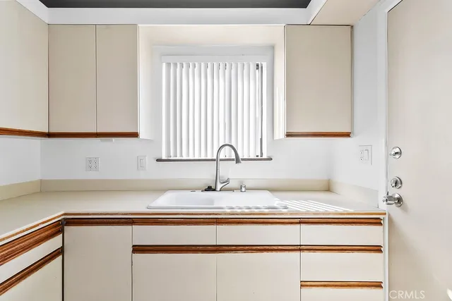a kitchen with a stove and a refrigerator