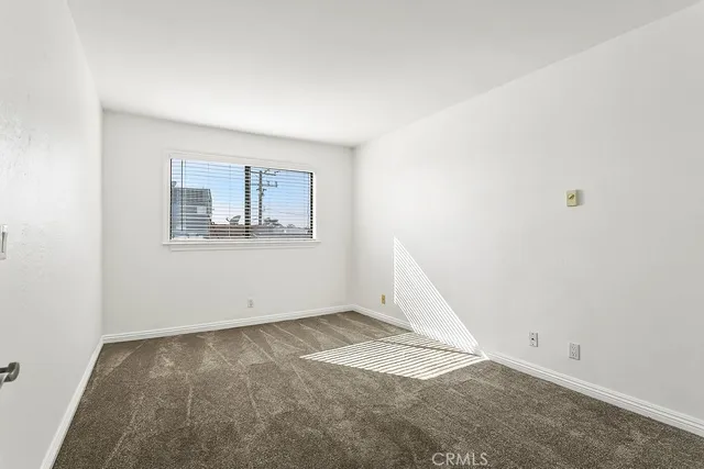 a bathroom with a double vanity sink mirror and toilet