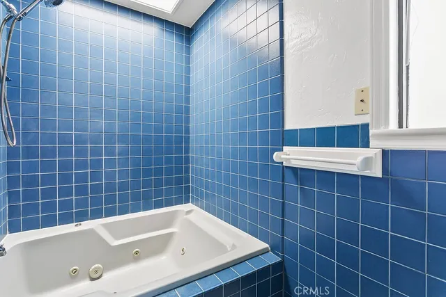 a balcony with wooden floor and lake view