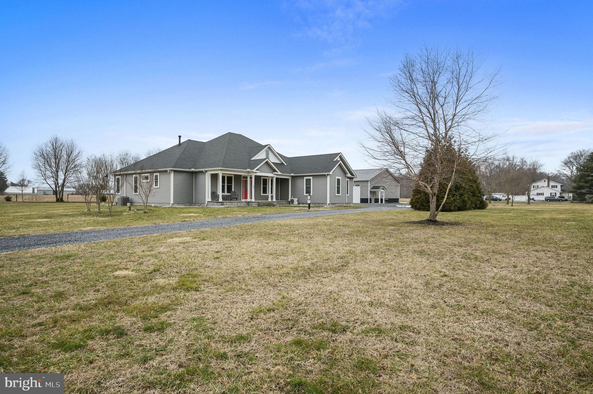 321 Blue Heron Road Dover, DE 19904 - Photo 1 of 47 a front view of a house with a yard