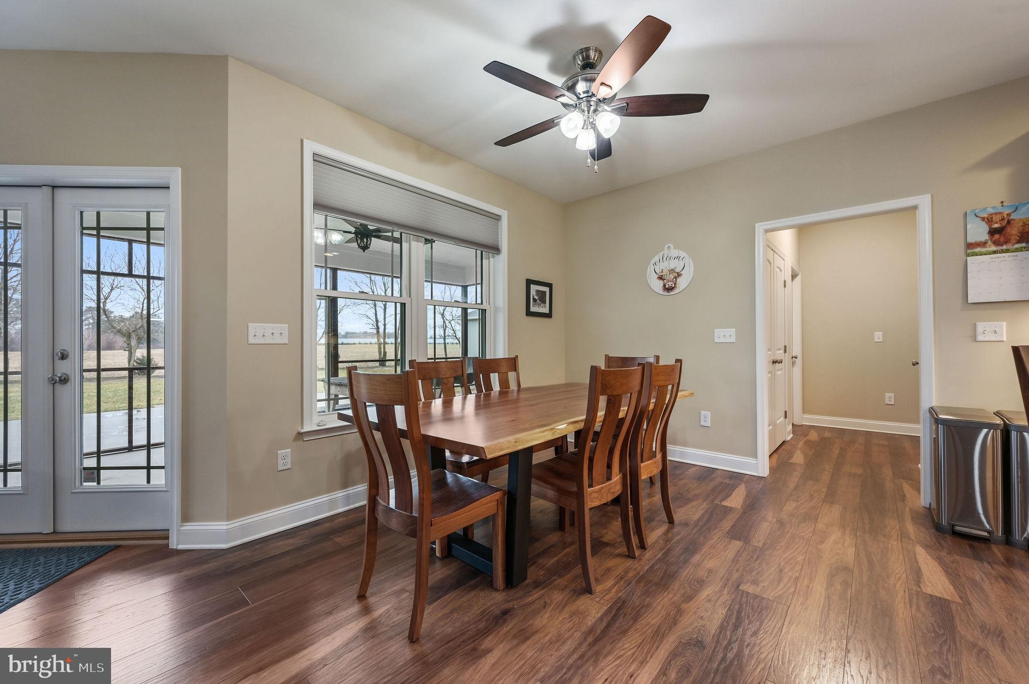 321 Blue Heron Road Dover, DE 19904 - Photo 13 of 47 a view of a dining room with furniture window and wooden floor