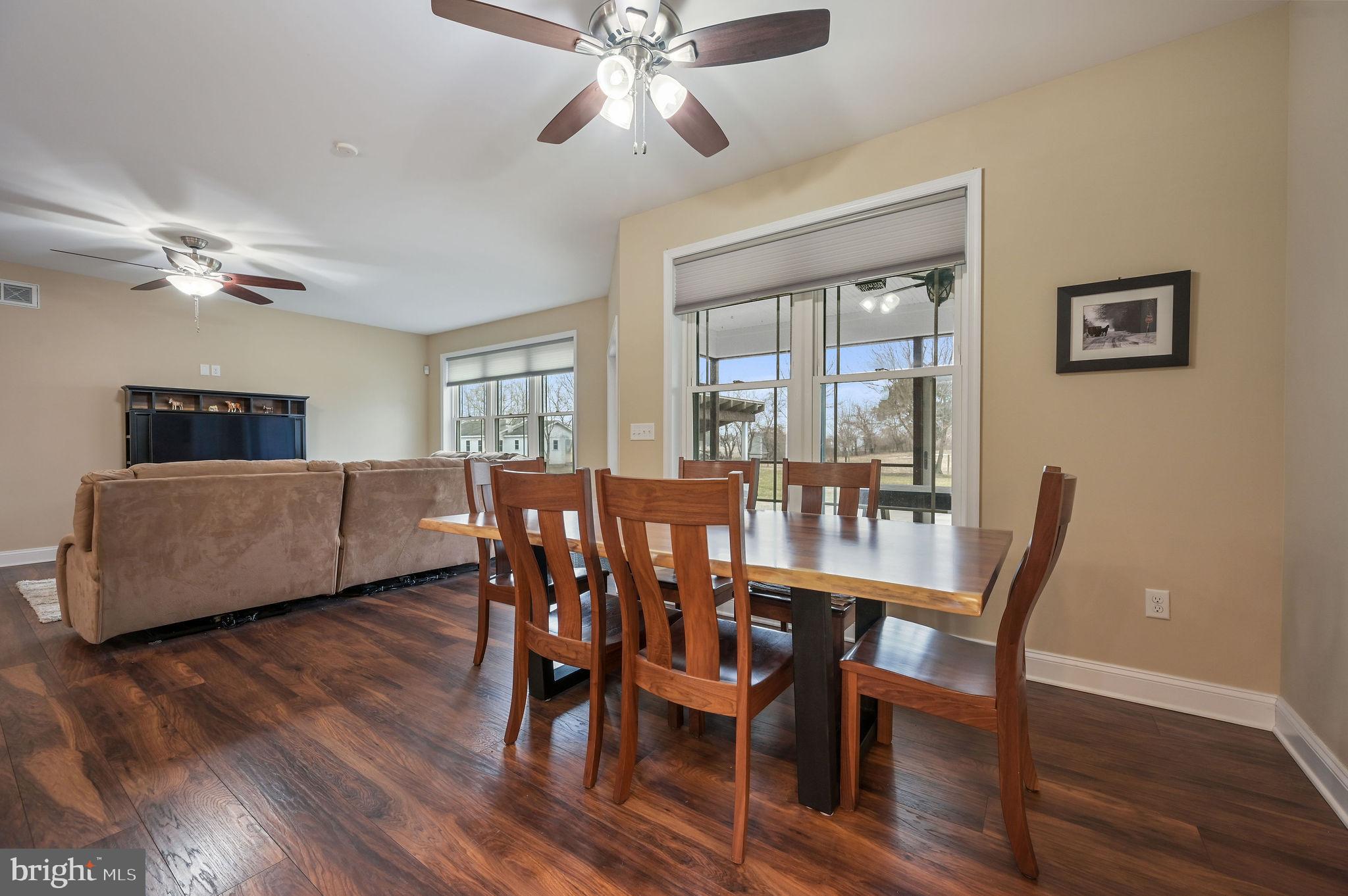 321 Blue Heron Road Dover, DE 19904 - Photo 14 of 47 a view of a dining room with furniture window and wooden floor