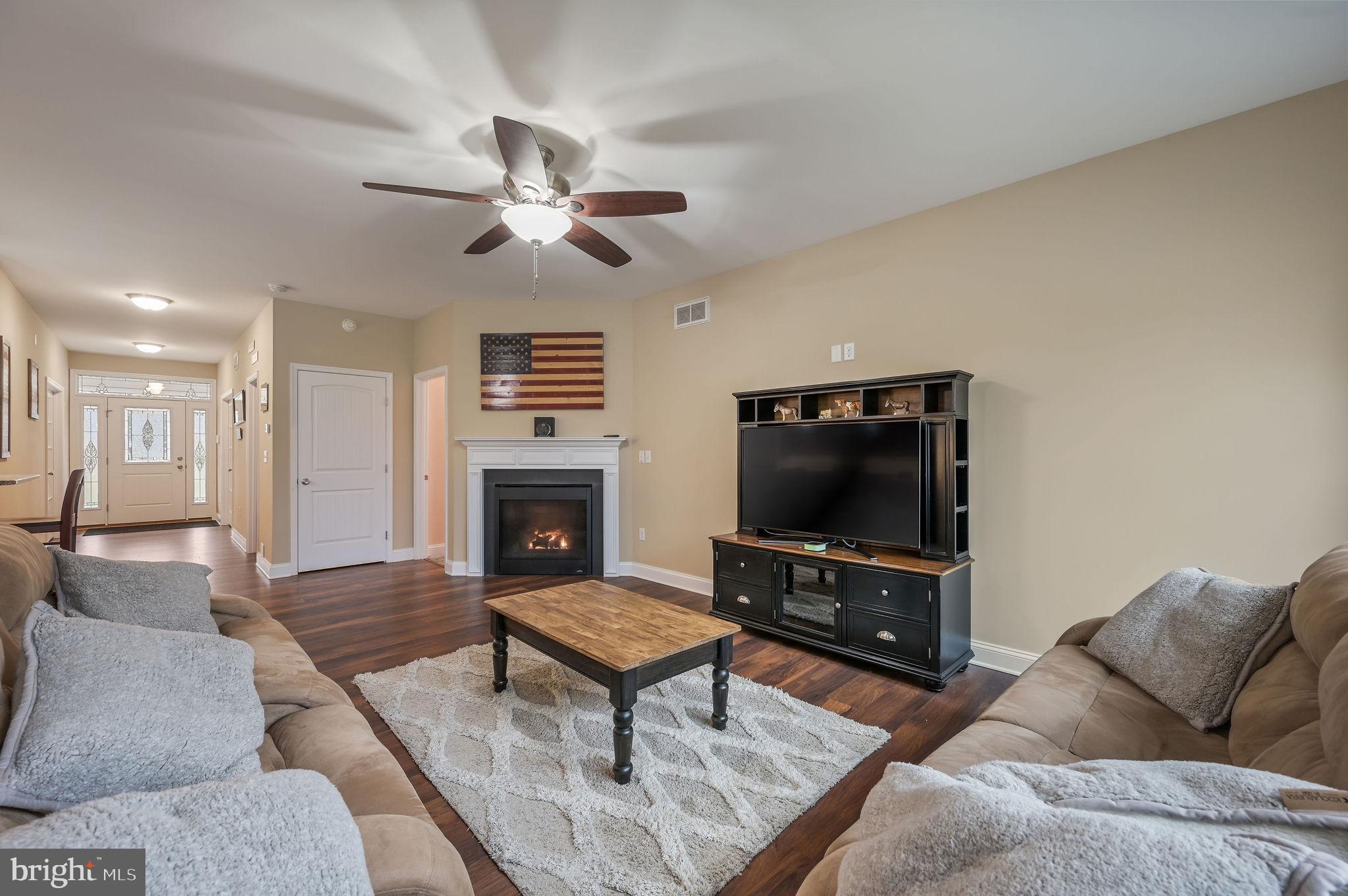 321 Blue Heron Road Dover, DE 19904 - Photo 17 of 47 a living room with furniture and a flat screen tv