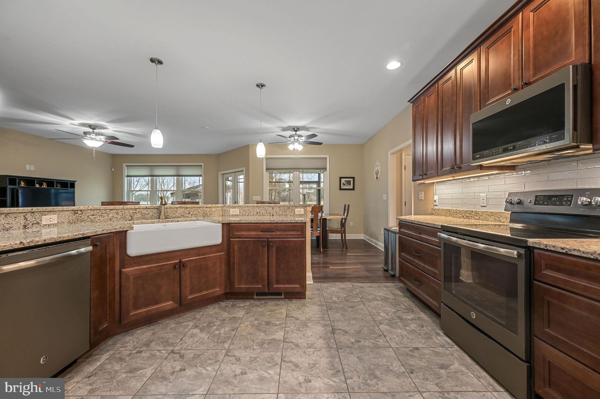 321 Blue Heron Road Dover, DE 19904 - Photo 22 of 47 a kitchen with lots of counter top space appliances and a sink