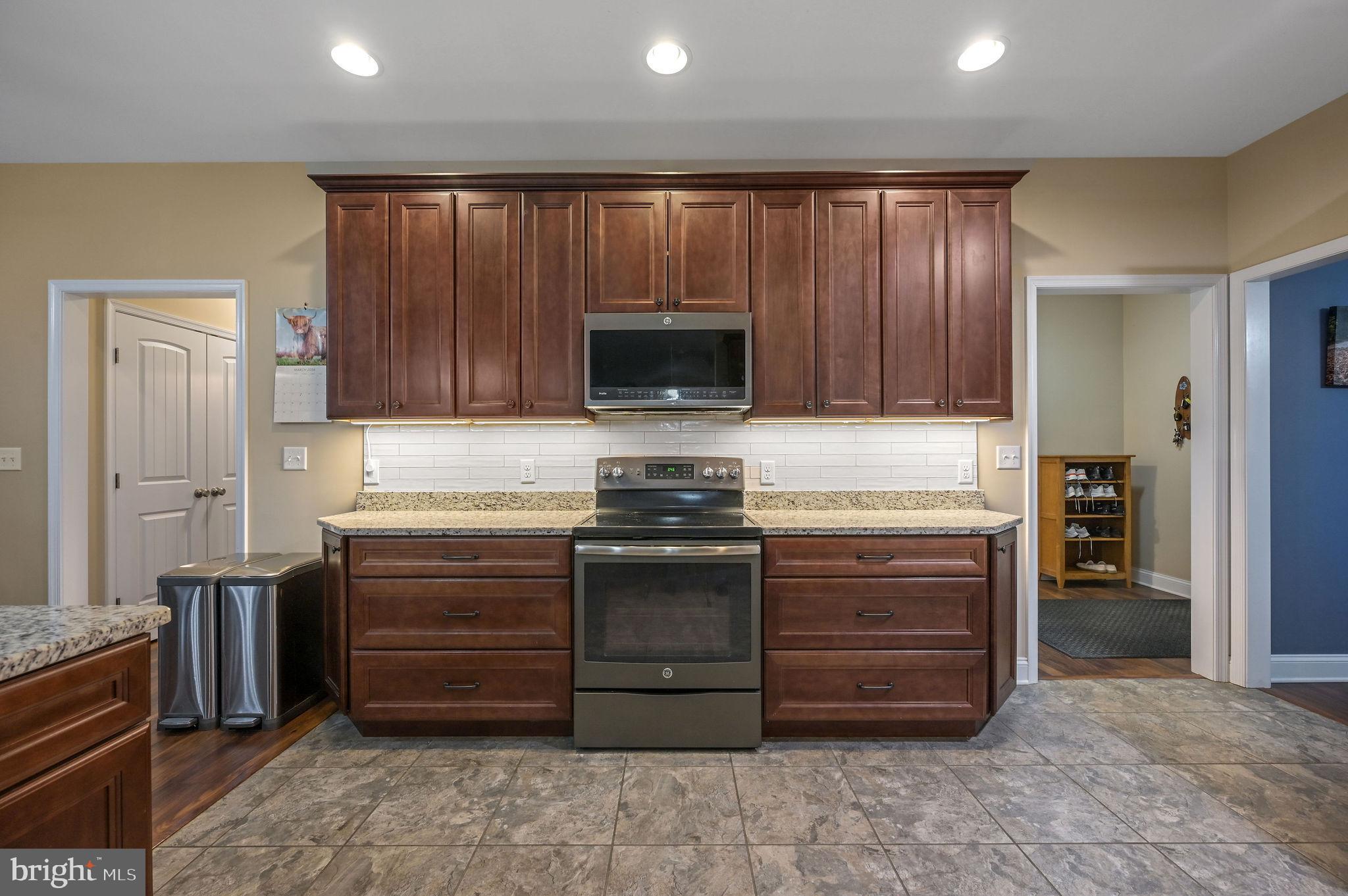 321 Blue Heron Road Dover, DE 19904 - Photo 24 of 47 a kitchen with a stove and a cabinet