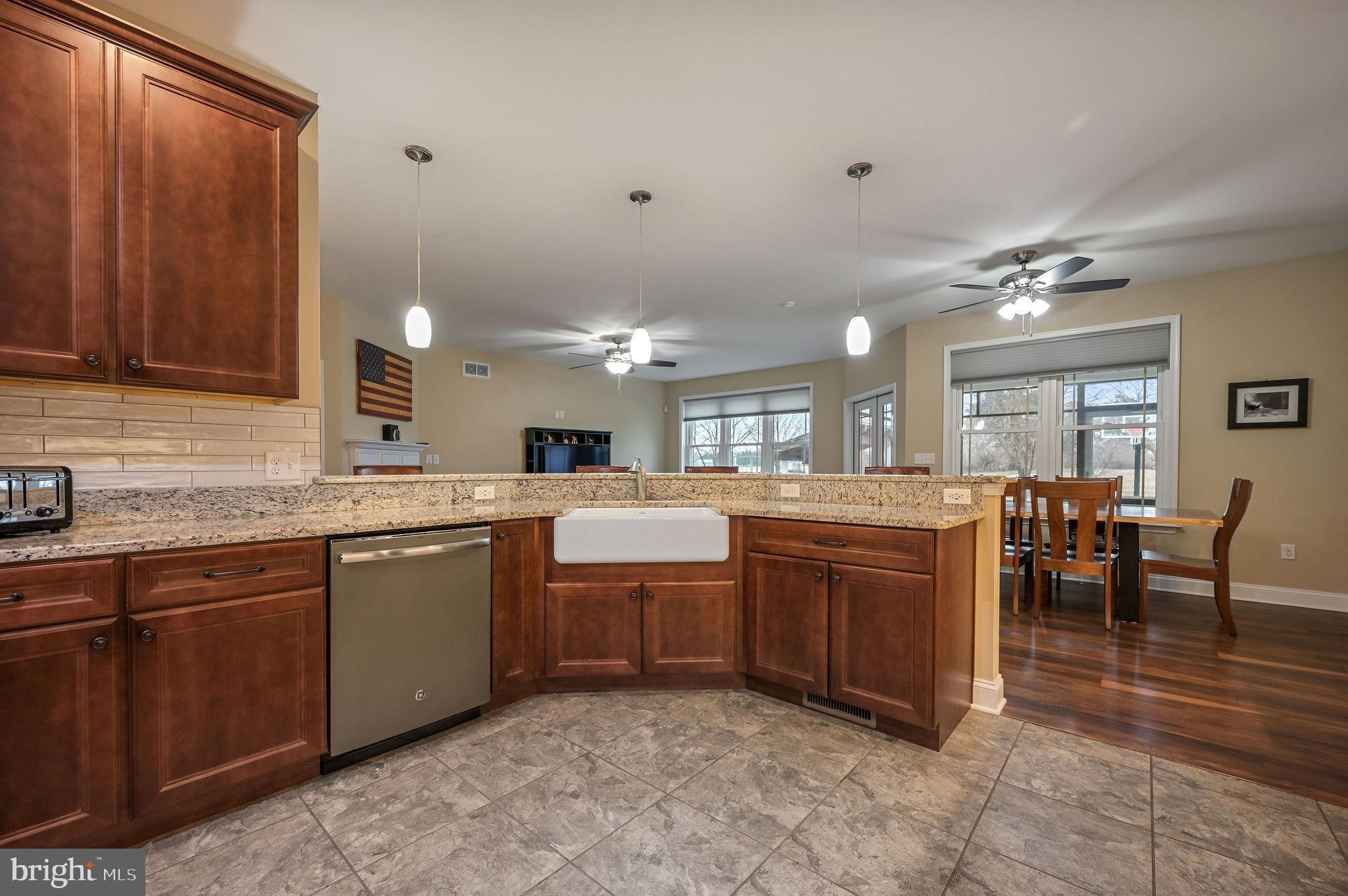 321 Blue Heron Road Dover, DE 19904 - Photo 25 of 47 a large kitchen with lots of counter and dining table