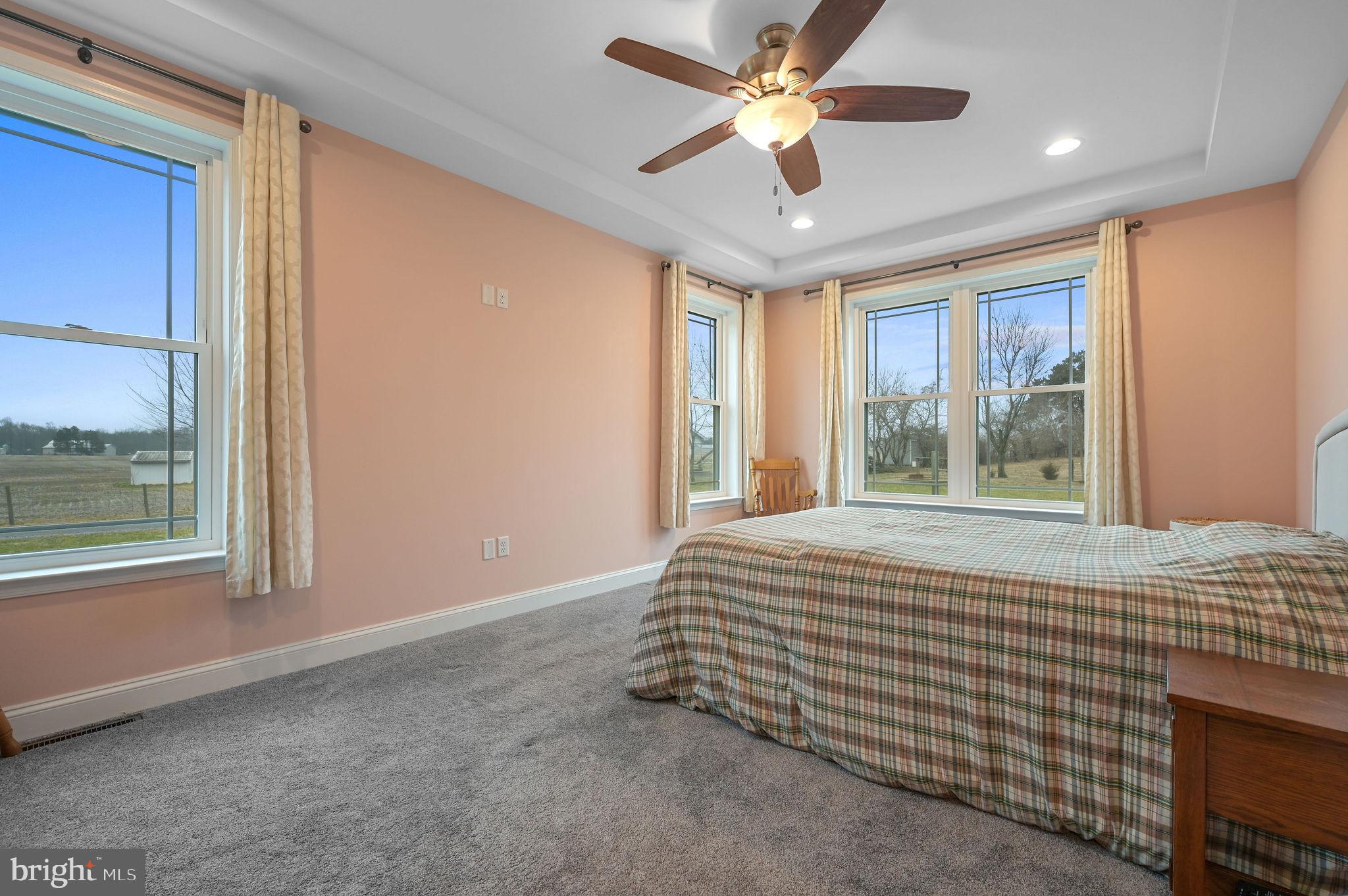 321 Blue Heron Road Dover, DE 19904 - Photo 29 of 47 a bed sitting in a spacious bedroom next to a window