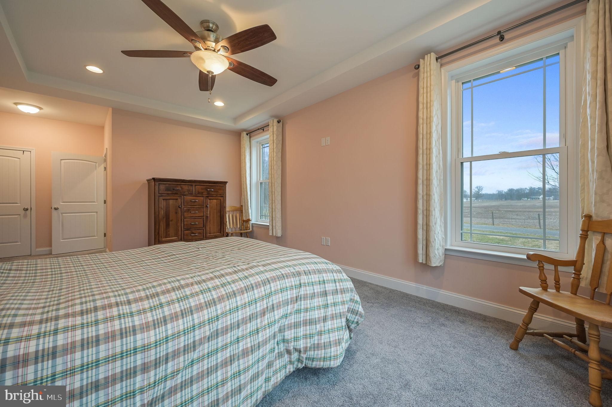 321 Blue Heron Road Dover, DE 19904 - Photo 30 of 47 a bedroom with a bed and a chandelier