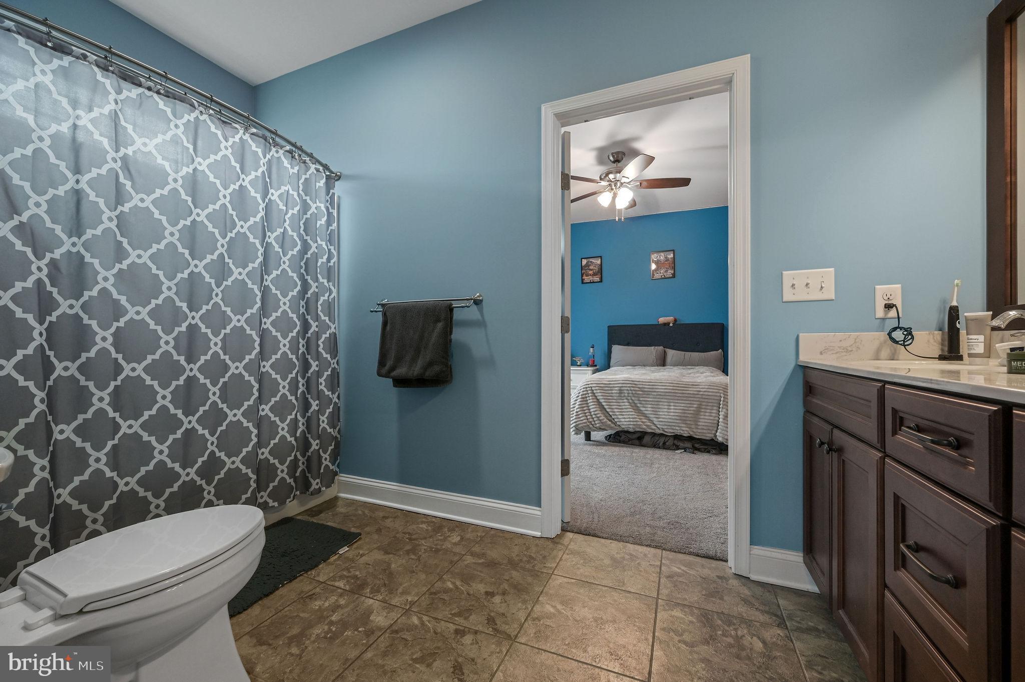 321 Blue Heron Road Dover, DE 19904 - Photo 37 of 47 a en suite bathroom with a toilet and a sink