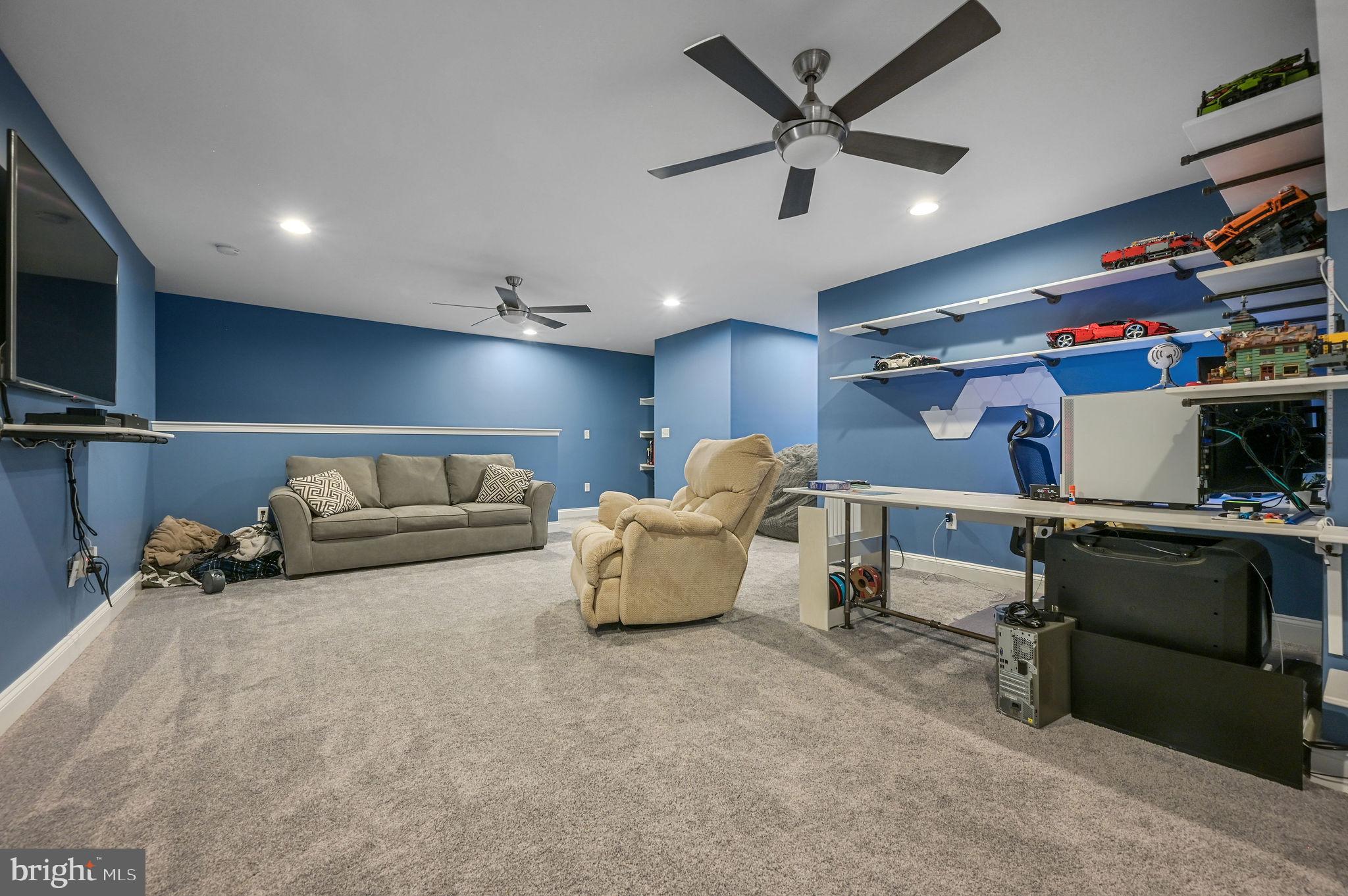 321 Blue Heron Road Dover, DE 19904 - Photo 38 of 47 a living room with furniture and a flat screen tv