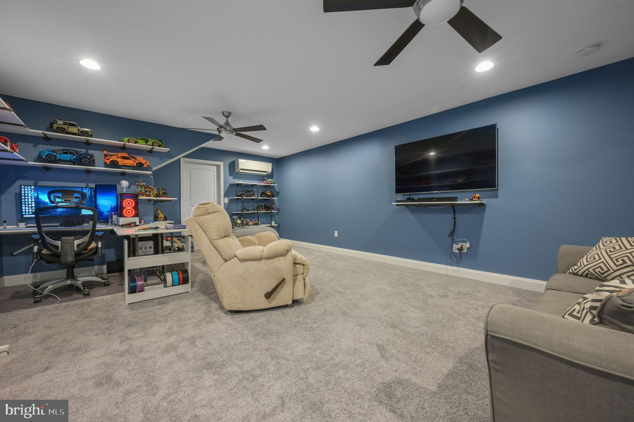 321 Blue Heron Road Dover, DE 19904 - Photo 39 of 47 a living room with furniture and a flat screen tv