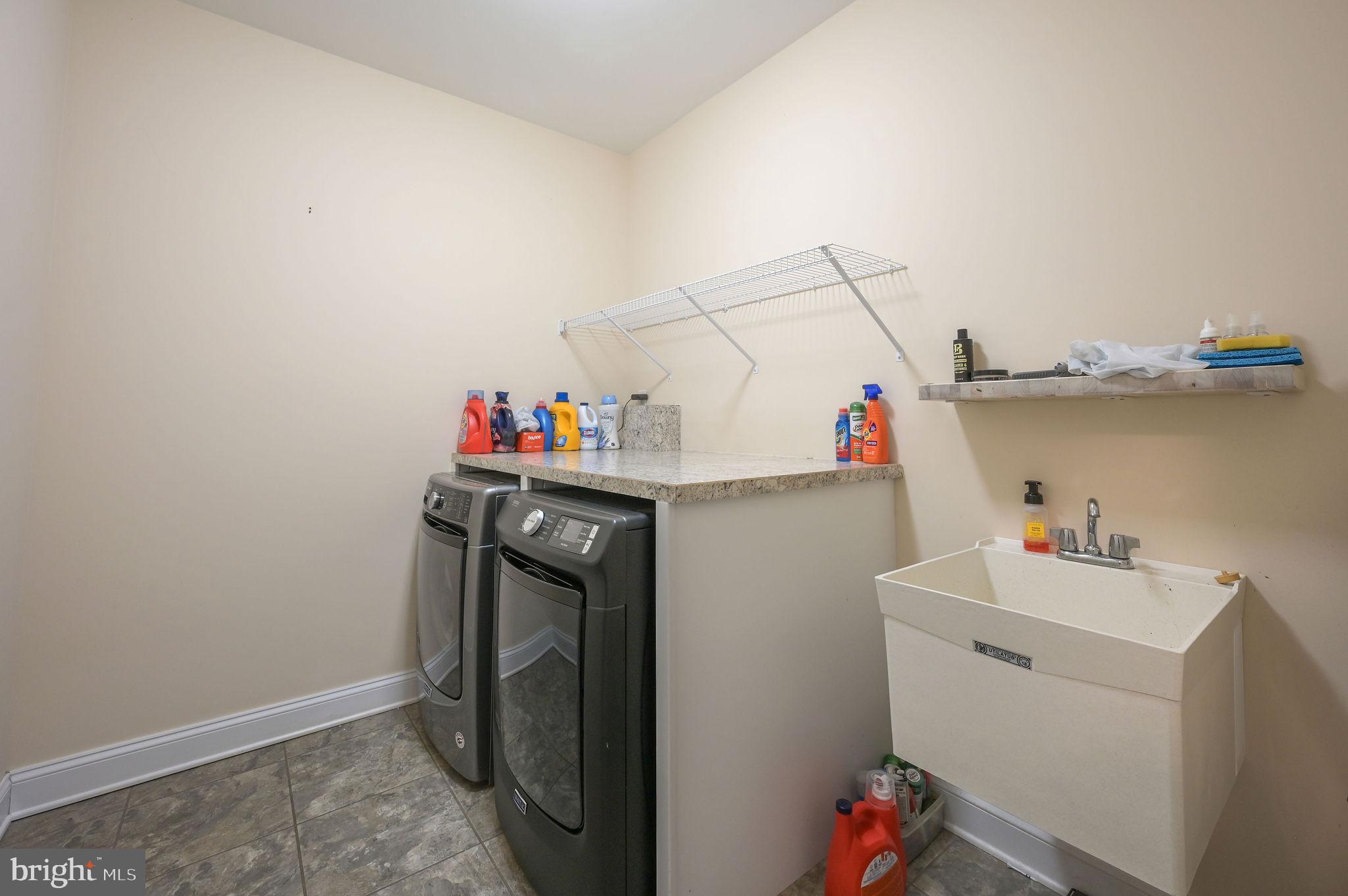 321 Blue Heron Road Dover, DE 19904 - Photo 40 of 47 a utility room with dryer and washer