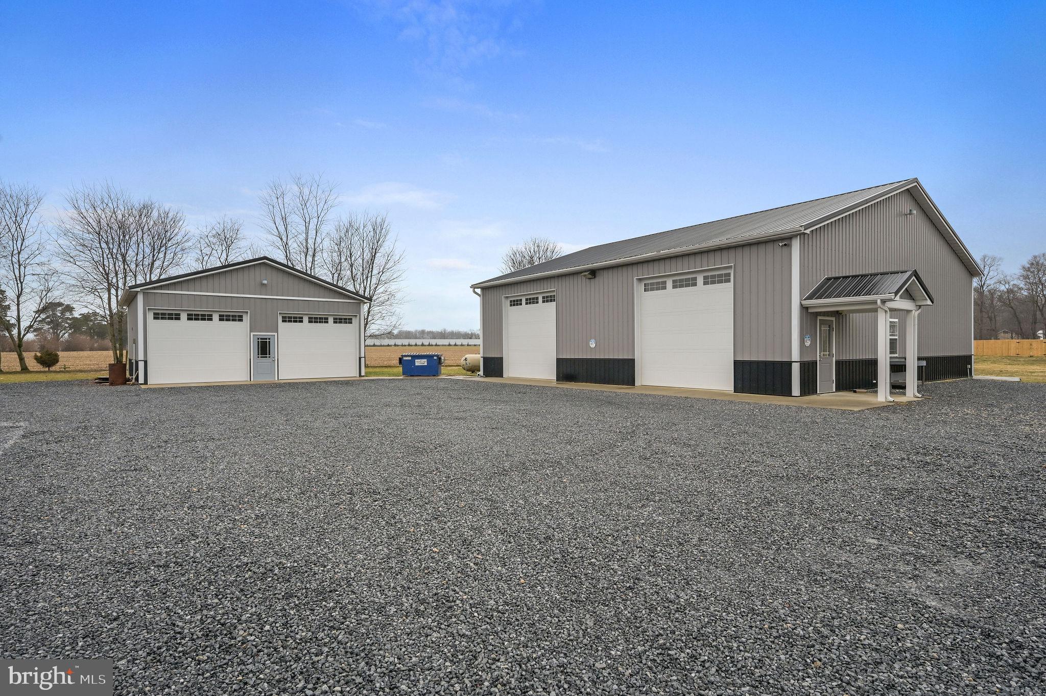 321 Blue Heron Road Dover, DE 19904 - Photo 41 of 47 a front view of a house with a yard and garage
