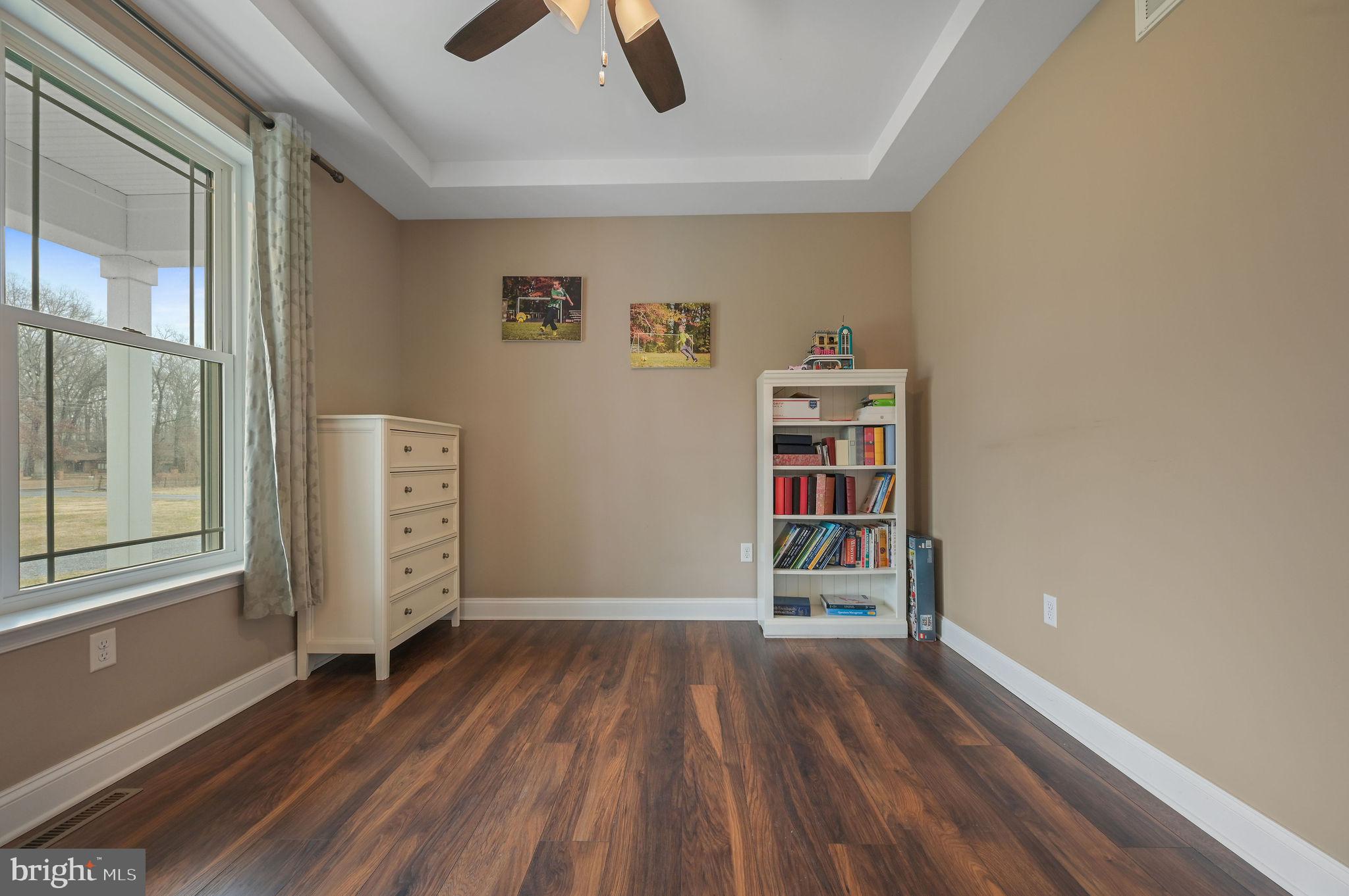 321 Blue Heron Road Dover, DE 19904 - Photo 9 of 47 an empty room with wooden floor closet and windows