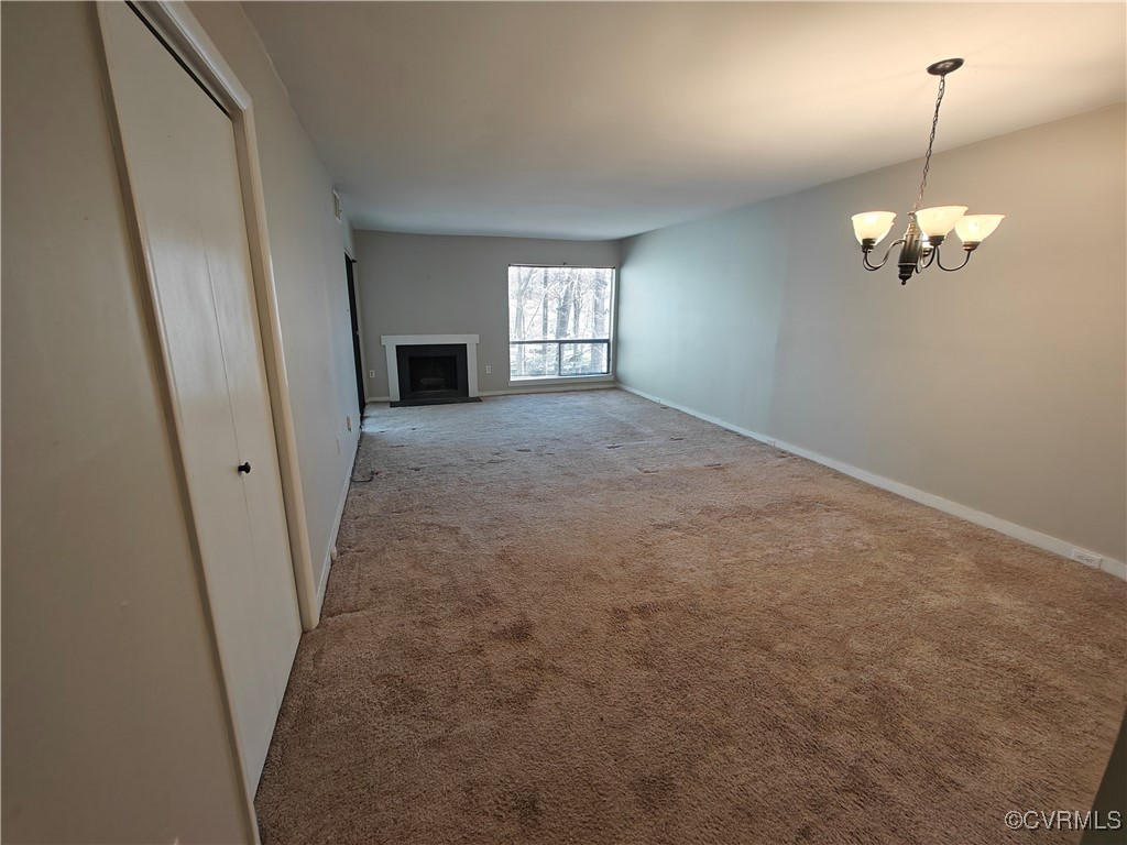 10258 Iron Mill Road North Chesterfield, VA 23235 - Photo 5 of 20 Living room with carpet flooring and a wood burnin