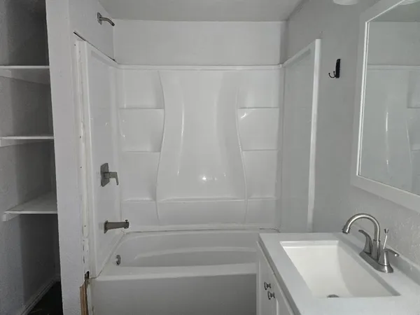 a bathroom with a sink and a bathtub