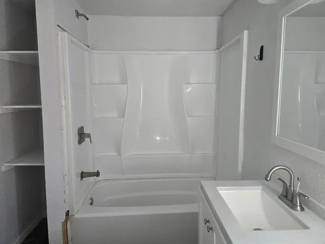 a bathroom with a sink and a bathtub