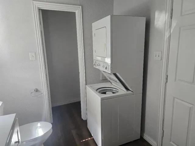 a view of a storage and utility room with a washer dryer