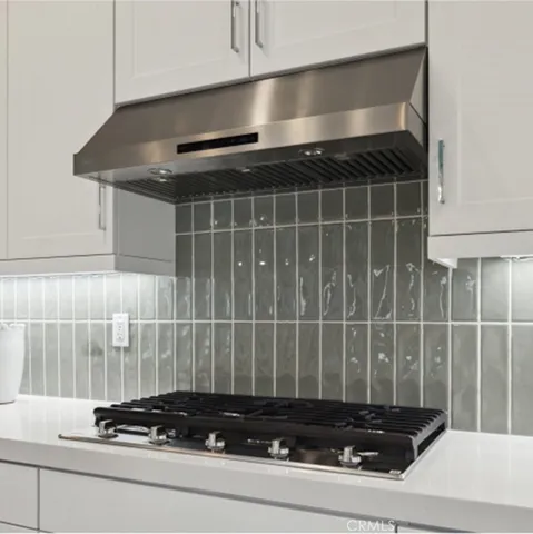 a bathroom with a granite countertop sink